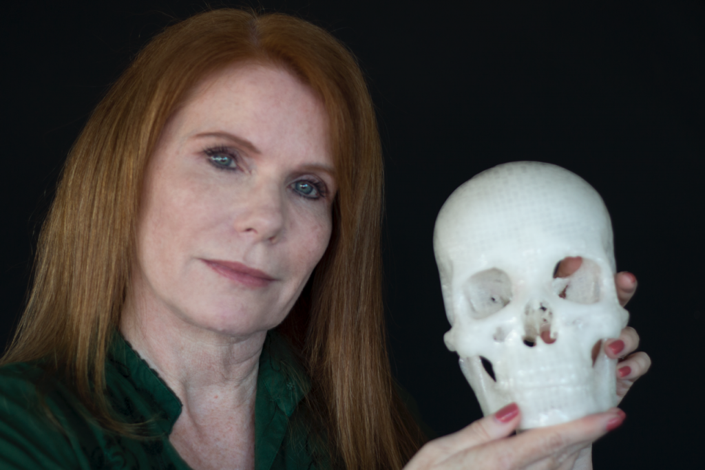 Simplify3D - Pamela Balzer holding 3D print of her skull